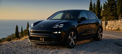 Porsche Macan — black SUV on a Mediterranean overlook