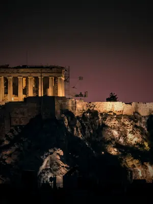 The Parthenon illuminated against the night sky